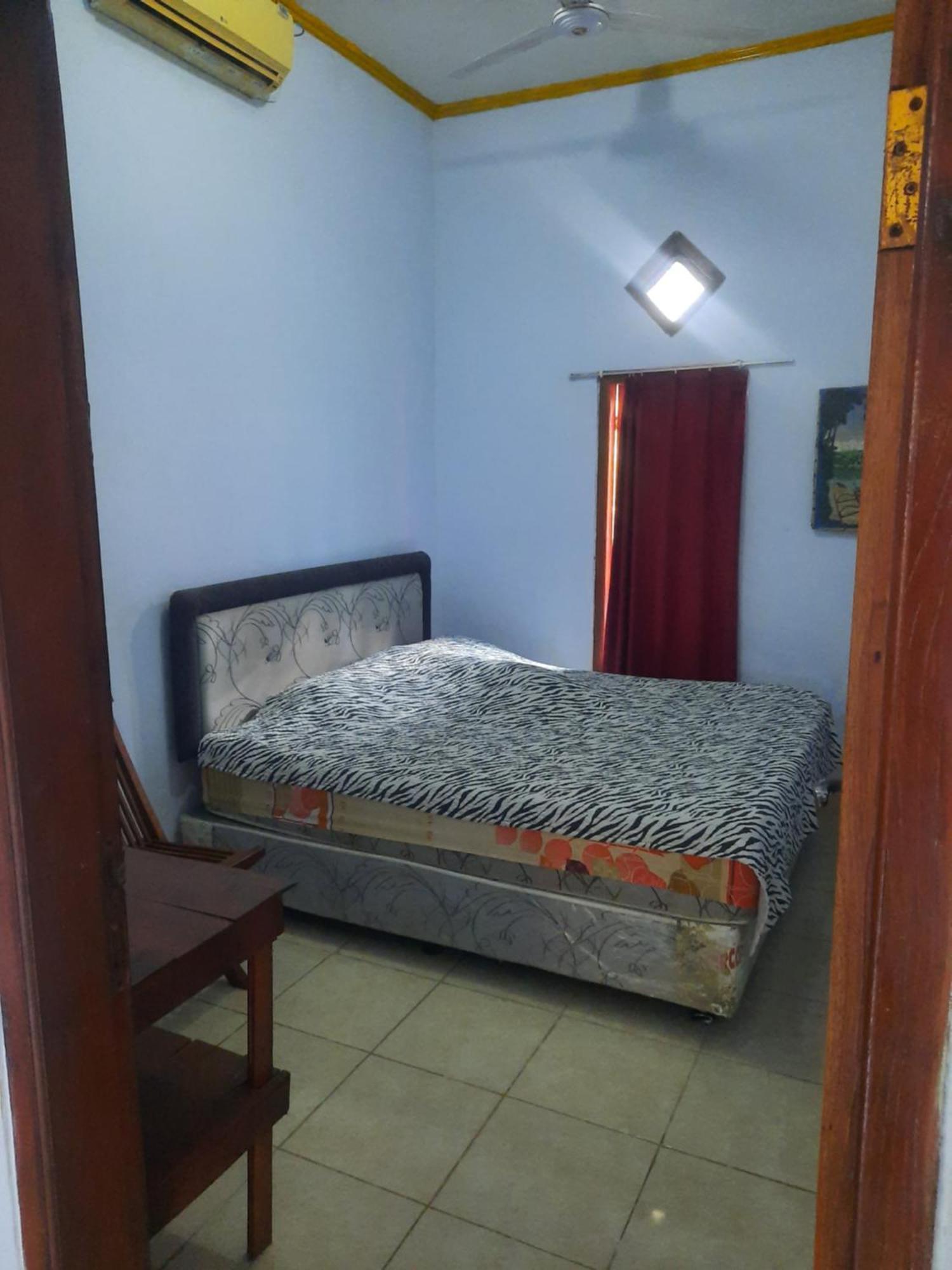 Red Beach Homestay Pasanggaran Værelse billede